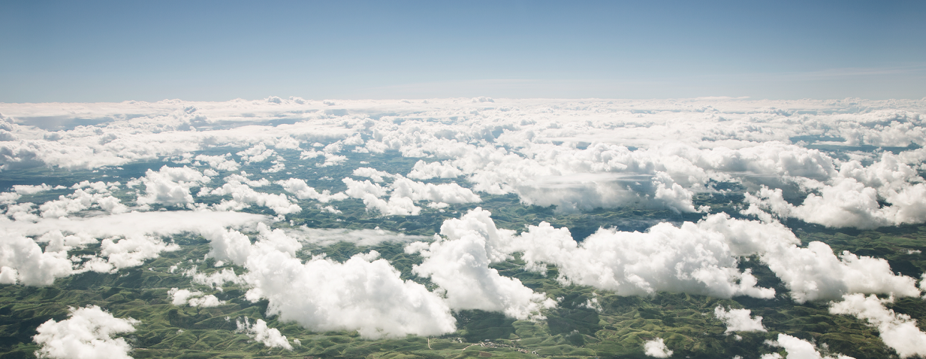 Sky, clouds, and green landscape