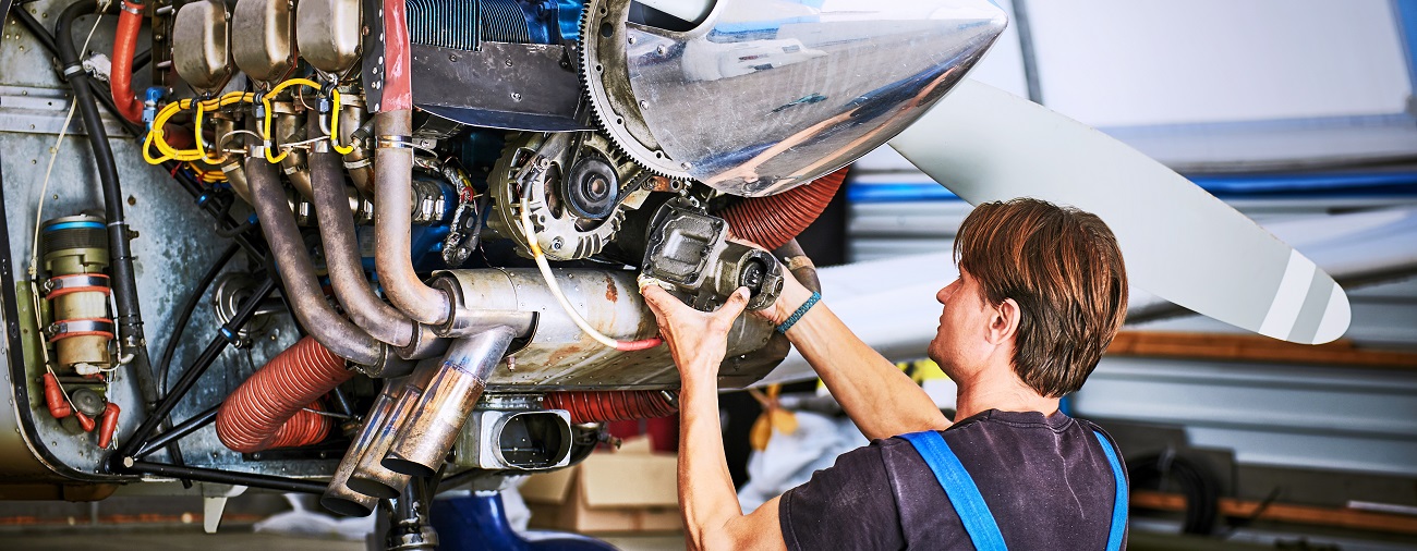 A mechanic working on an aircraft.